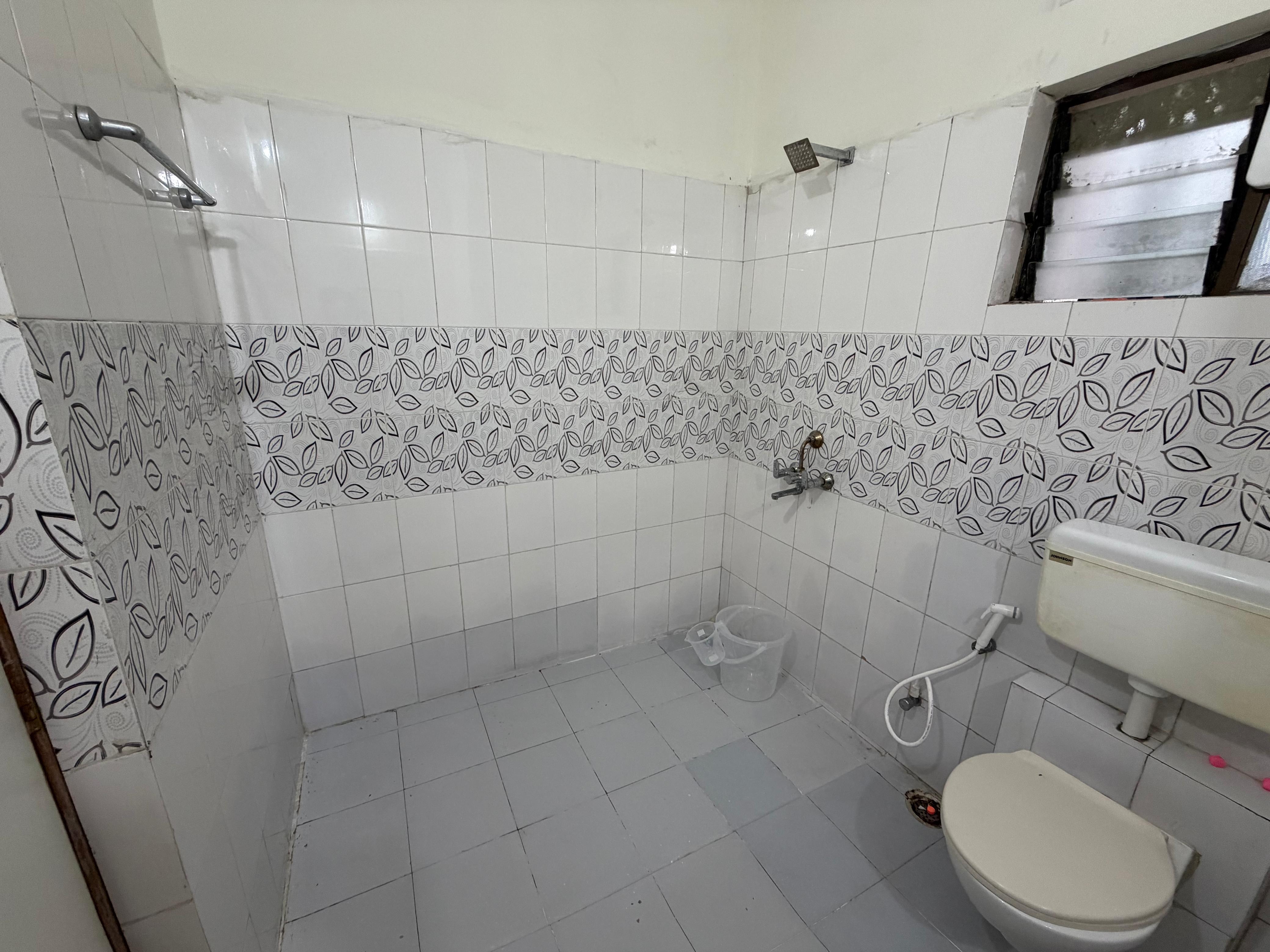 Clean attached bathroom with shower